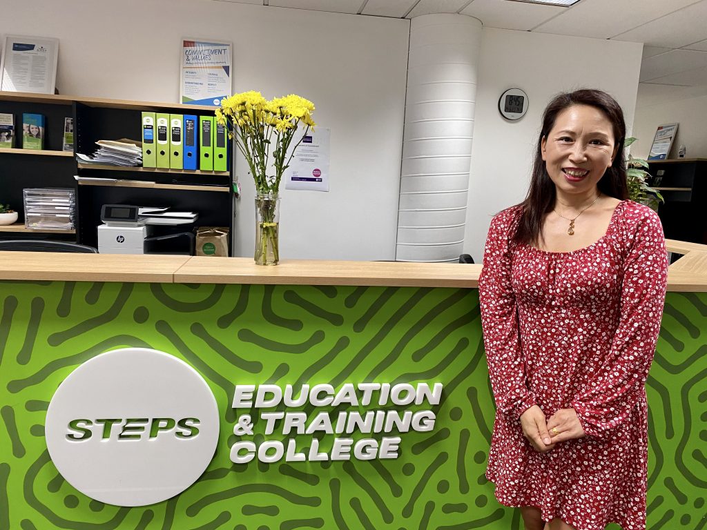 Student Yan li at the reception desk