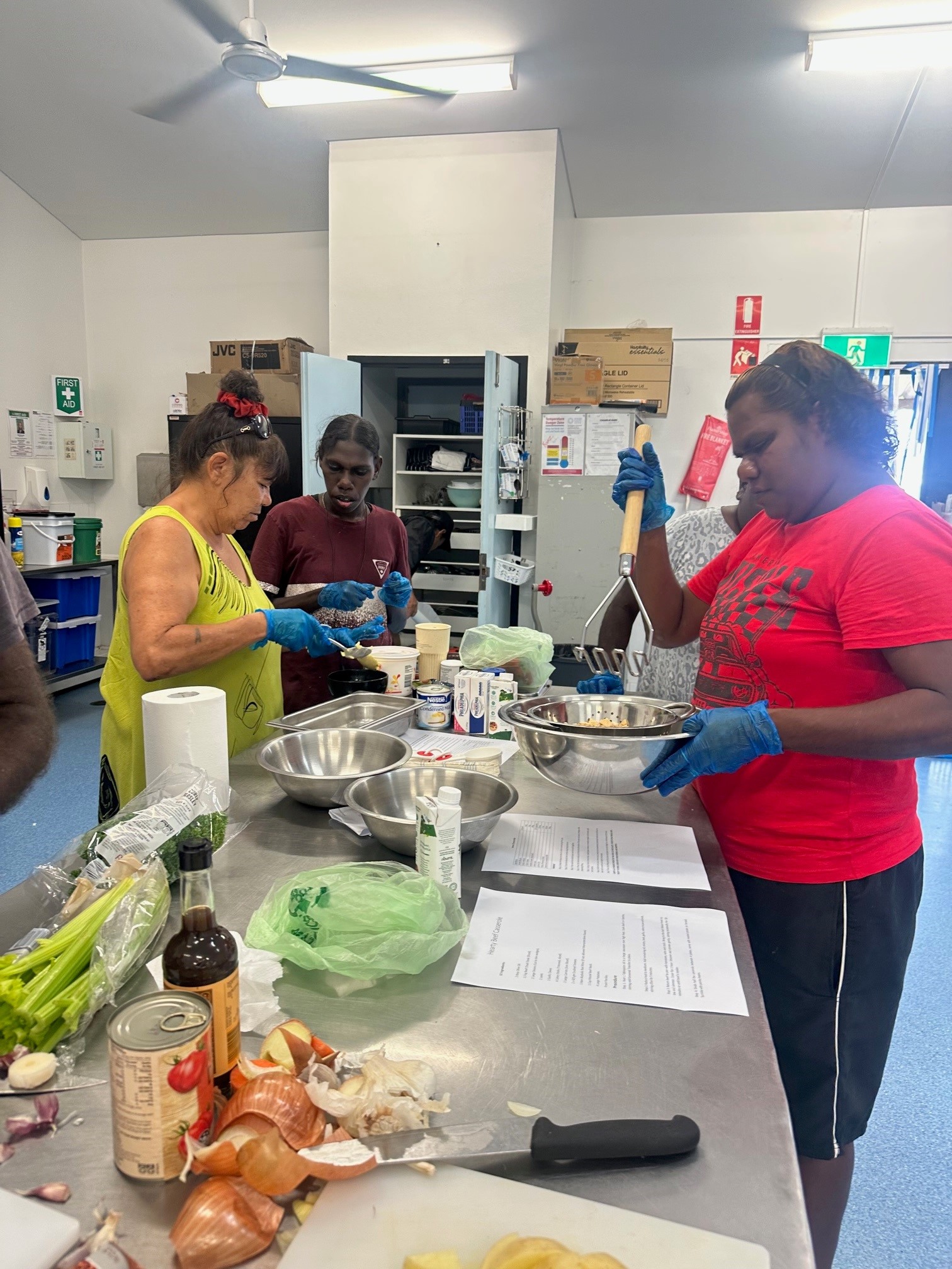 Client cooking a meal as part of the SEE program at STEPS