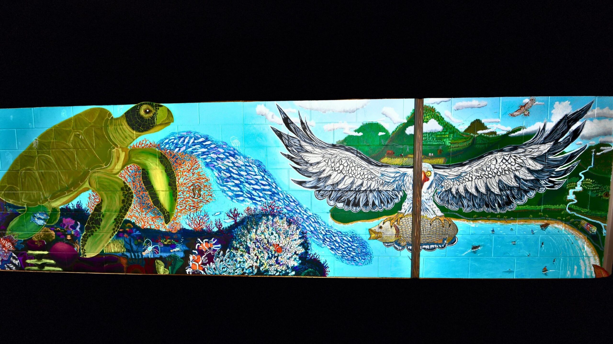 Painted mural displaying turtle, seagull and aquatic life.