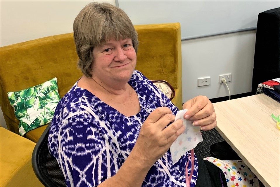 STEPS Volunteer Kerri Roberts sews